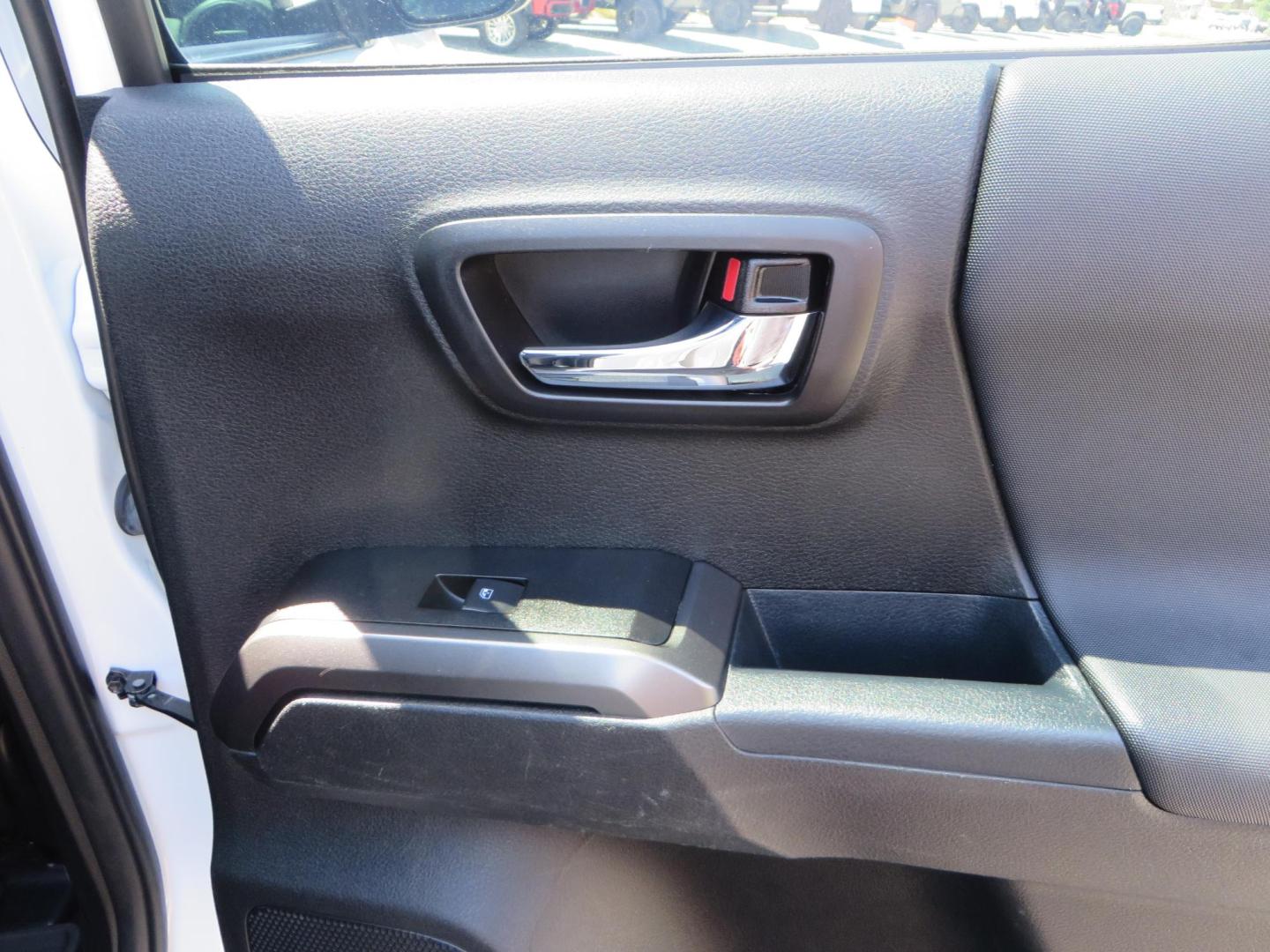 2021 White Toyota Tacoma SR5 Double Cab V6 6AT 4WD (3TYCZ5AN8MT) with an 3.5L V6 DOHC 24V engine, 6A transmission, located at 2630 Grass Valley Highway, Auburn, CA, 95603, (530) 508-5100, 38.937893, -121.095482 - Leveled Tacoma sitting on 18" Fuel wheels, Toyo RT tires, and window tint. - Photo#49