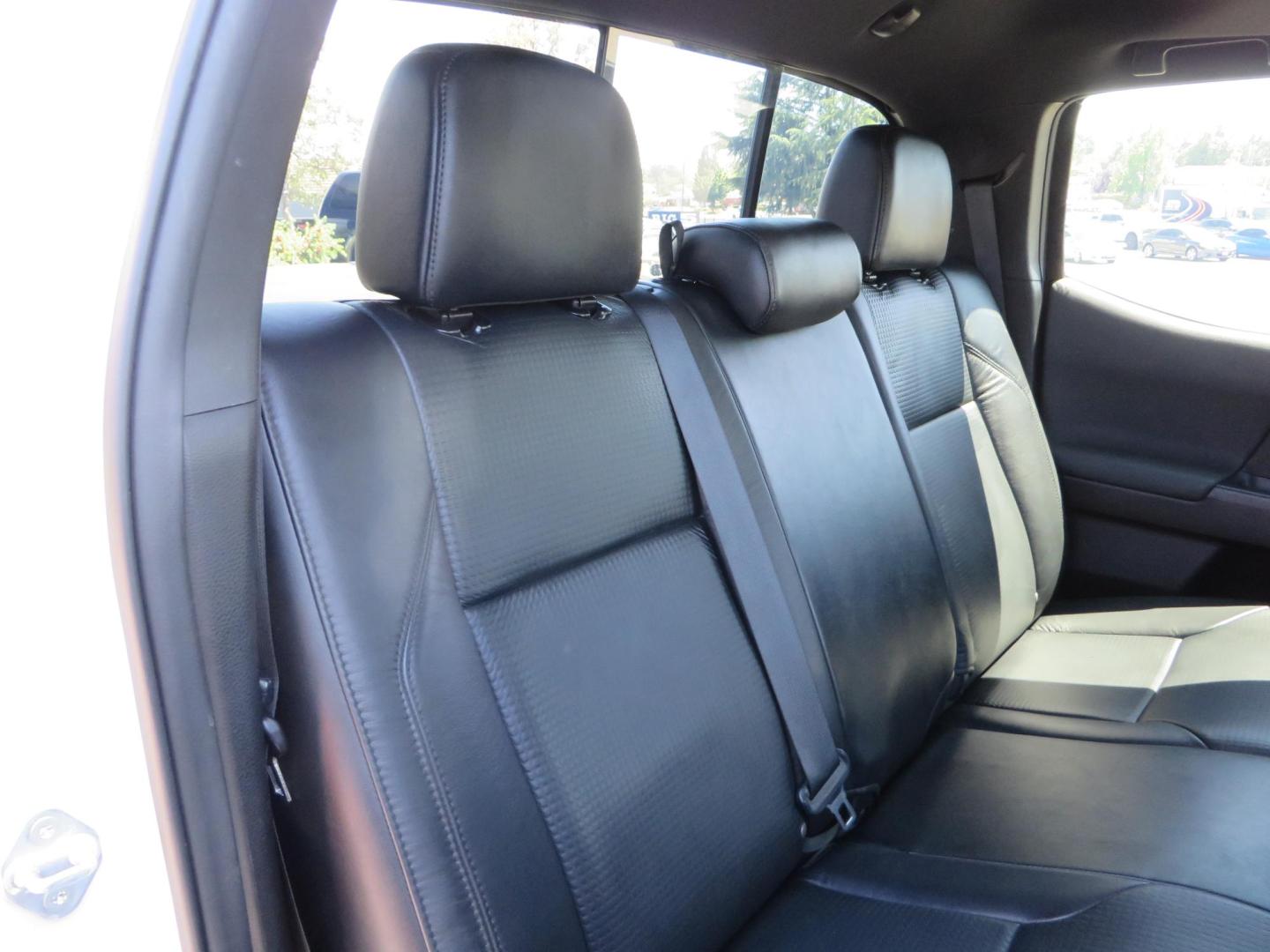 2021 White Toyota Tacoma SR5 Double Cab V6 6AT 4WD (3TYCZ5AN8MT) with an 3.5L V6 DOHC 24V engine, 6A transmission, located at 2630 Grass Valley Highway, Auburn, CA, 95603, (530) 508-5100, 38.937893, -121.095482 - Leveled Tacoma sitting on 18" Fuel wheels, Toyo RT tires, and window tint. - Photo#51