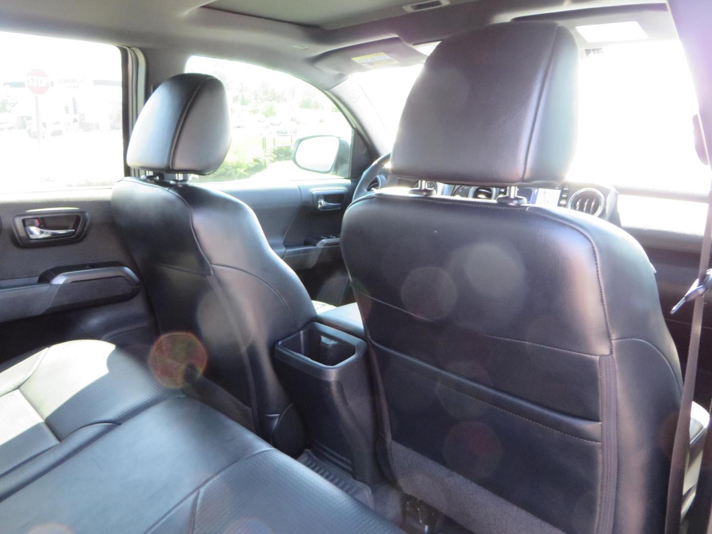 2021 White Toyota Tacoma SR5 Double Cab V6 6AT 4WD (3TYCZ5AN8MT) with an 3.5L V6 DOHC 24V engine, 6A transmission, located at 2630 Grass Valley Highway, Auburn, CA, 95603, (530) 508-5100, 38.937893, -121.095482 - Leveled Tacoma sitting on 18" Fuel wheels, Toyo RT tires, and window tint. - Photo#53