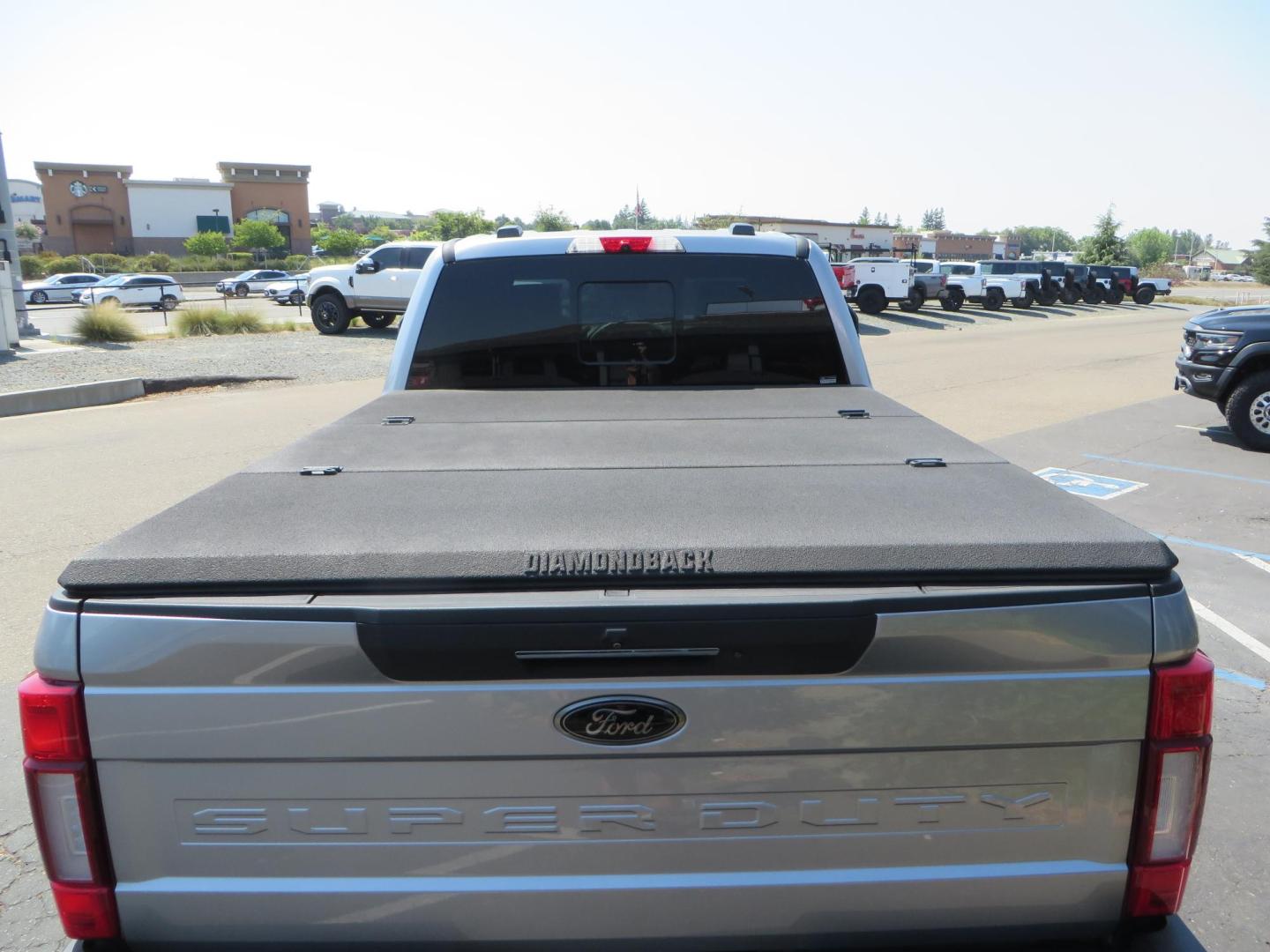 2022 SILVER /BLACK Ford F-250 SD Lariat Crew Cab 4WD (1FT8W2BT6NE) with an 6.7L V8 OHV 16V DIESEL engine, 6A transmission, located at 2630 Grass Valley Highway, Auburn, CA, 95603, (530) 508-5100, 38.937893, -121.095482 - Dont miss this F-250 sitting on a Carli Back Country suspension system, Fox remote reservoir shocks, Radius arms, Deaver rear springs, Torsion sway bar, upper and lower stabilizers, 37" Toyo RT Trail tires, 17" Innov8 G500 wheels, Baja Designs Fog light kit, Diamondback bedcover, Bed Molle panels, - Photo#17