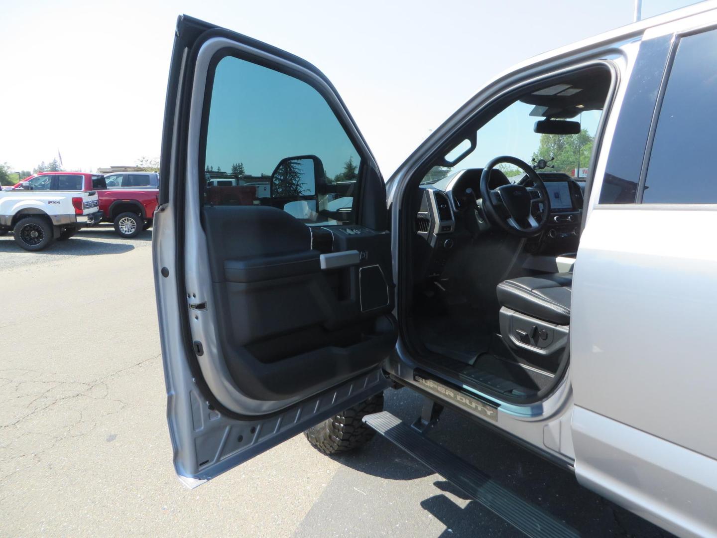 2022 SILVER /BLACK Ford F-250 SD Lariat Crew Cab 4WD (1FT8W2BT6NE) with an 6.7L V8 OHV 16V DIESEL engine, 6A transmission, located at 2630 Grass Valley Highway, Auburn, CA, 95603, (530) 508-5100, 38.937893, -121.095482 - Dont miss this F-250 sitting on a Carli Back Country suspension system, Fox remote reservoir shocks, Radius arms, Deaver rear springs, Torsion sway bar, upper and lower stabilizers, 37" Toyo RT Trail tires, 17" Innov8 G500 wheels, Baja Designs Fog light kit, Diamondback bedcover, Bed Molle panels, - Photo#24