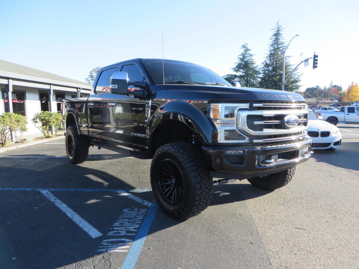 2022 BLACK /BLACK Ford F-250 SD Platinum Tremor Crew Cab Short Bed 4WD (1FT8W2BT2NE) with an 6.7L V8 OHV 16V DIESEL engine, 10 speed transmission, located at 2630 Grass Valley Highway, Auburn, CA, 95603, (530) 508-5100, 38.937893, -121.095482 - Features - BDS 4" Radius arm suspension system, Fox 2.0 shocks, Dual Fox steering stabilizers, 37" Nitto Ridge Grappler tires, 20" Fuel Rebel wheels, Airlift air bags, Airlift wireless 1 compressor, and window tint. - Photo#6