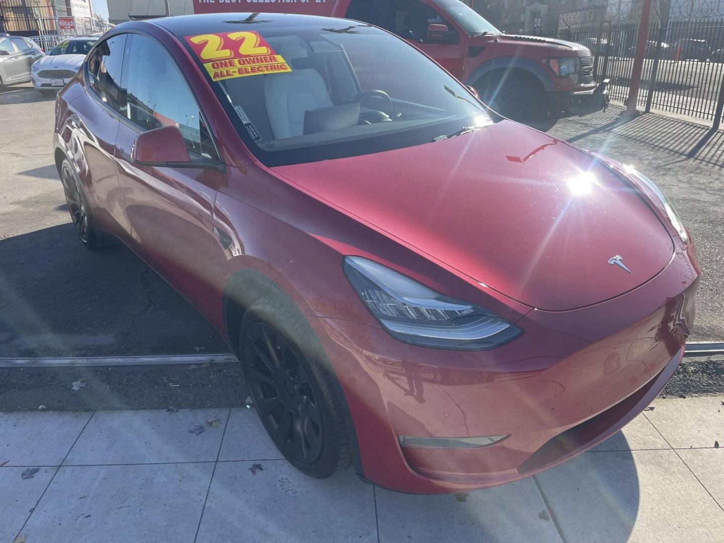 2022 RED Tesla Model Y Long Range (7SAYGDEE1NF) with an ELECTRIC engine, 1A transmission, located at 744 E Miner Ave, Stockton, CA, 95202, (209) 944-5770, 37.956863, -121.282082 - PLUS TAXES AND FEES - Photo#1