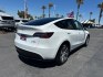 2023 White Tesla Model Y (7SAYGDEE2PF) with an Dual AC Electric Motors engine, Single-Speed Fixed Gear transmission, located at 412 Auto Vista Drive, Palmdale, 93551, (661) 945-0620, 34.592636, -118.136681- Photo#2
