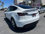 2023 White Tesla Model Y (7SAYGDEE2PF) with an Dual AC Electric Motors engine, Single-Speed Fixed Gear transmission, located at 412 Auto Vista Drive, Palmdale, 93551, (661) 945-0620, 34.592636, -118.136681- Photo#4