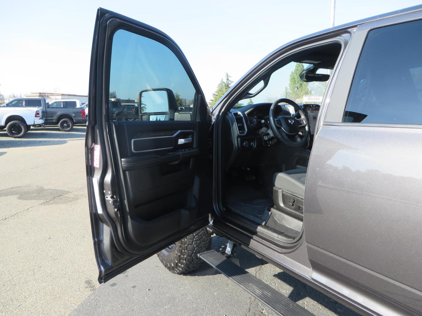2024 CHARCOAL /BLACK RAM 2500 Big Horn Crew Cab SWB 4WD (3C6UR5DL7RG) with an 6.7L L6 OHV 24V TURBO DIESEL engine, 6A transmission, located at 2630 Grass Valley Highway, Auburn, CA, 95603, (530) 508-5100, 38.937893, -121.095482 - Leveled Ram sitting on 37" Toyo RT trail tires, 17" Method MR318 wheels, Fox 2.5 remote reservoir shock up front, Amp Power steps, and window tint. - Photo#22