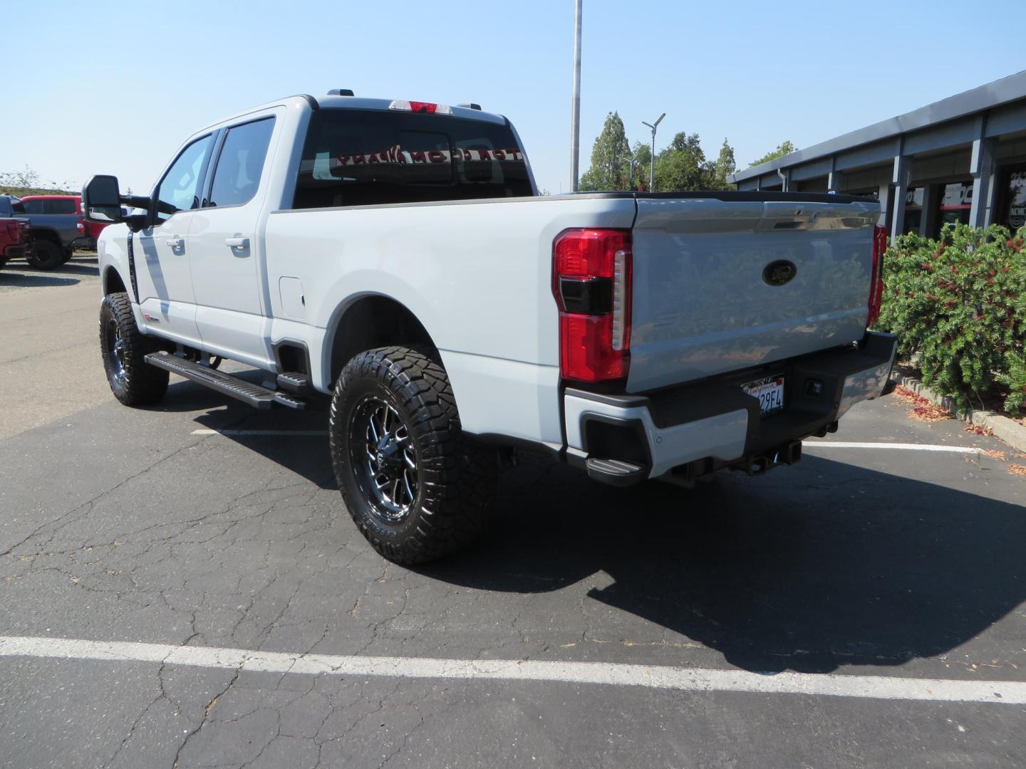 2025 Gray /Black Ford F-350 SD Lariat Crew Cab Short Bed 4WD (1FT8W3BM5SE) with an 6.7L V8 OHV 16V DIESEL engine, 6A transmission, located at 2630 Grass Valley Highway, Auburn, CA, 95603, (530) 508-5100, 38.937893, -121.095482 - Features a Readylift level kit, Falcon shocks, 20" Fuel Triton wheels, and 37" Nitto Ridge Grappler tires. - Photo#2