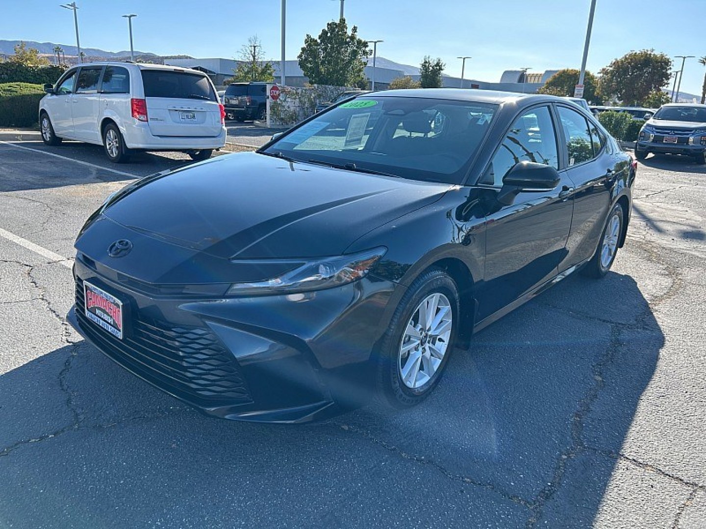 2025 Black Toyota Camry (4T1DAACK0SU) with an 4-Cyl Hybrid 2.5 Liter engine, Automatic CVT transmission, located at 412 Auto Vista Drive, Palmdale, 93551, (661) 945-0620, 34.592636, -118.136681- Photo#2