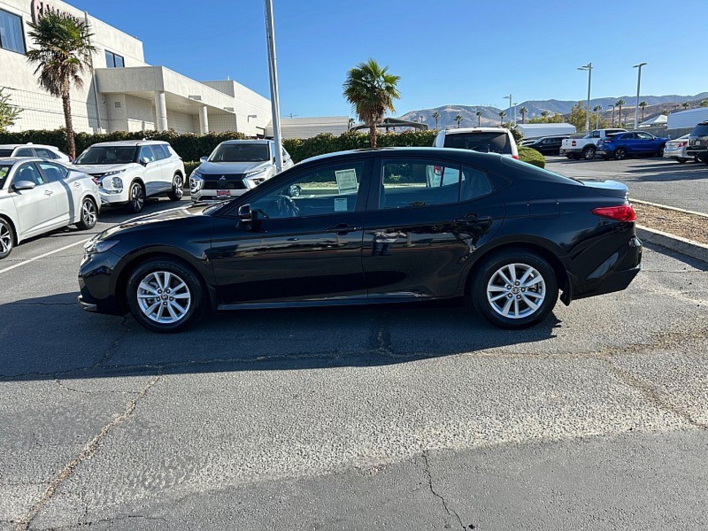 2025 Black Toyota Camry (4T1DAACK0SU) with an 4-Cyl Hybrid 2.5 Liter engine, Automatic CVT transmission, located at 412 Auto Vista Drive, Palmdale, 93551, (661) 945-0620, 34.592636, -118.136681- Photo#3